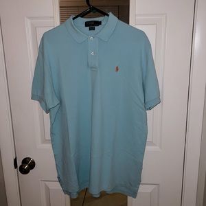 Turquoise Polo shirt with orange logo